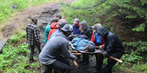 Expedition leadership program students executing a backcountry evacuation drill.