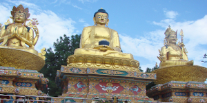 Ornate golden statues at a Buddhist temple complex in Nepal